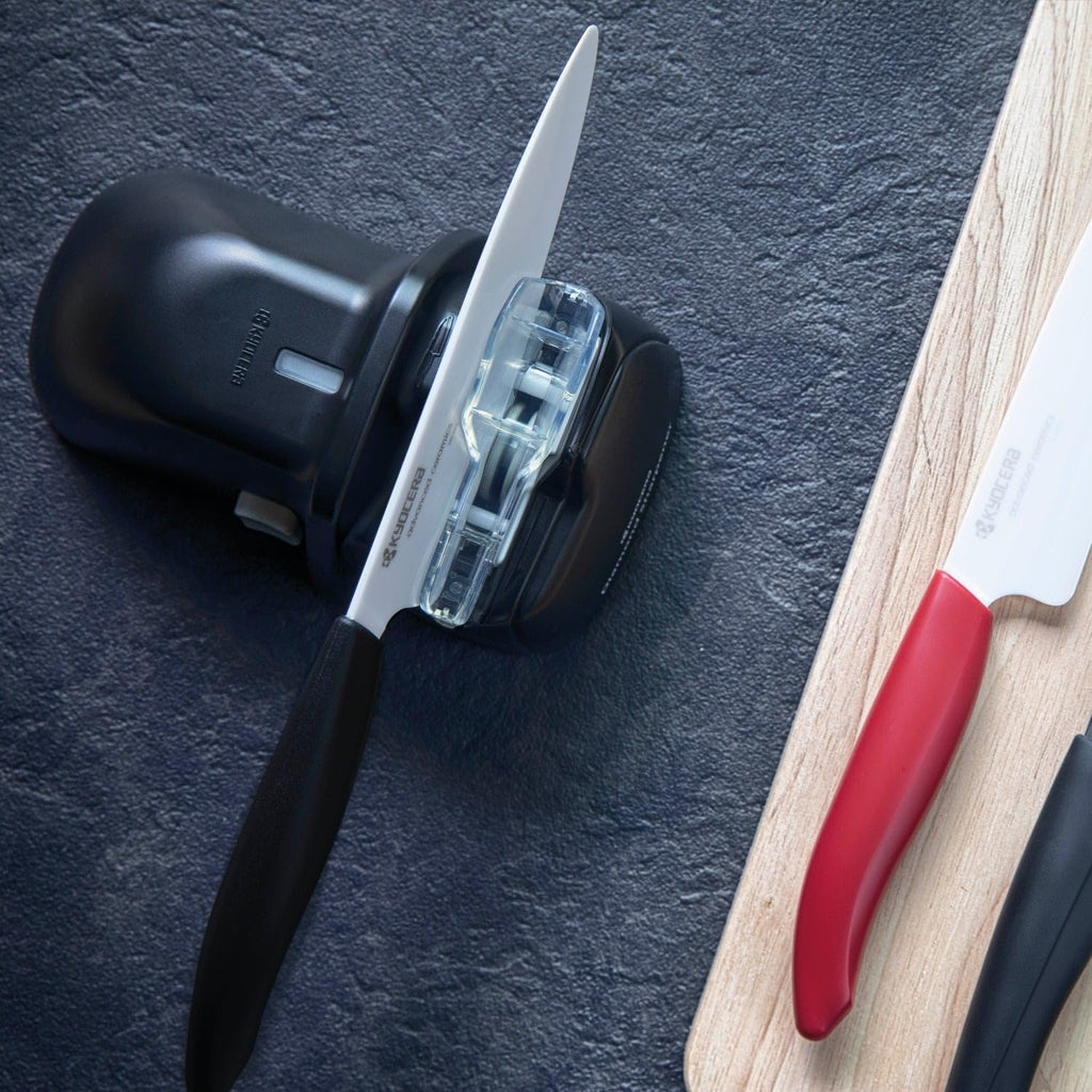 Kyocera Electric Diamond Knife Sharpener. For ceramic knives. Integrate Knife Guide and roller Assist. Battery operated.